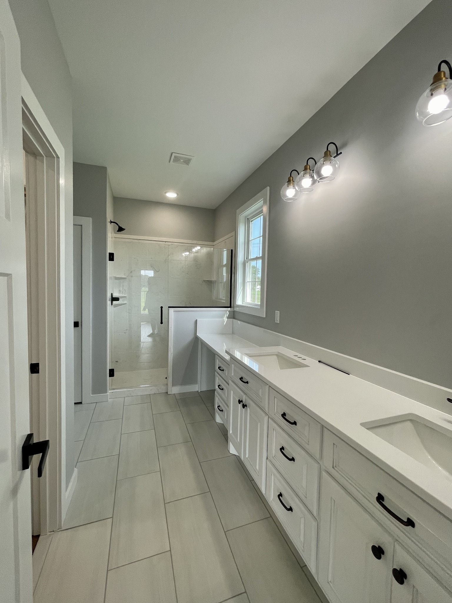 1448 Fall River Road Lawrenceburg, TN 38464 - Photo 10 of 30 a bathroom with a double vanity sink and mirror