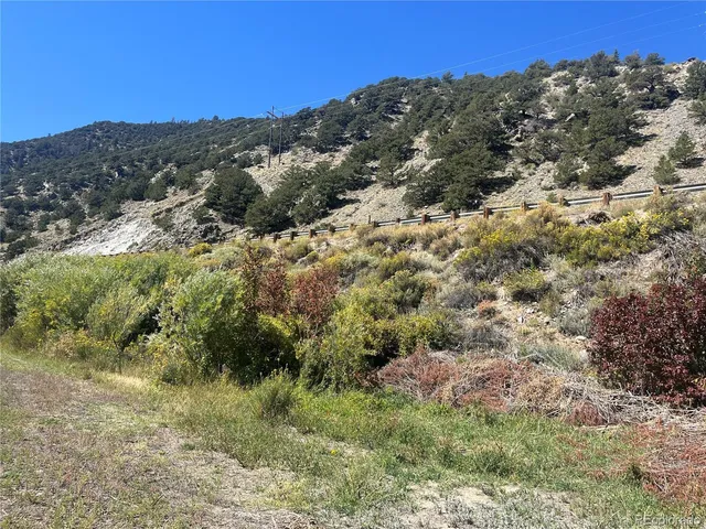 a view of a building with mountains in the background