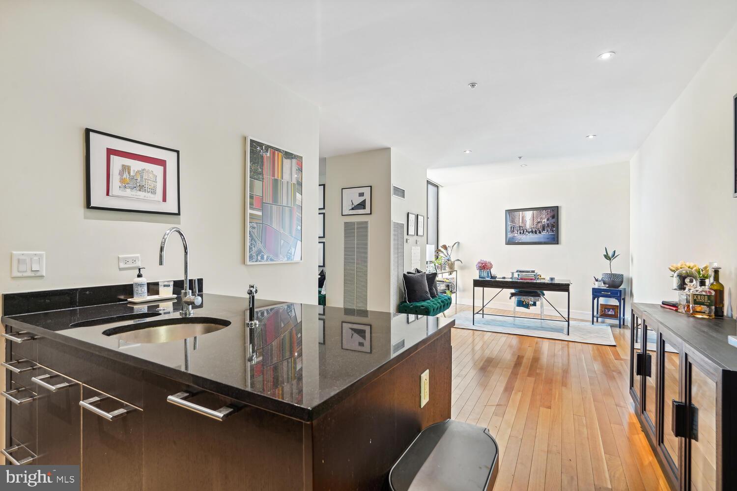 3303 Water Street Northwest, Unit 3L Washington, DC 20007 - Photo 17 of 40 Kitchen peninsula breakfast bar - view to dining