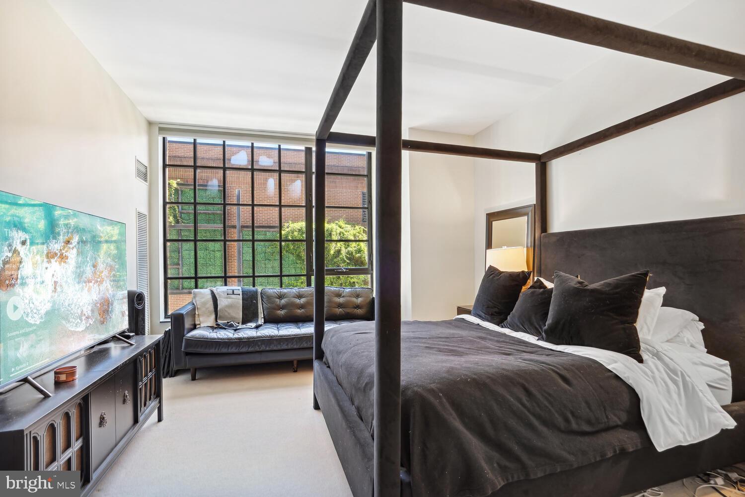 3303 Water Street Northwest, Unit 3L Washington, DC 20007 - Photo 23 of 40 King-size primary bedroom suite