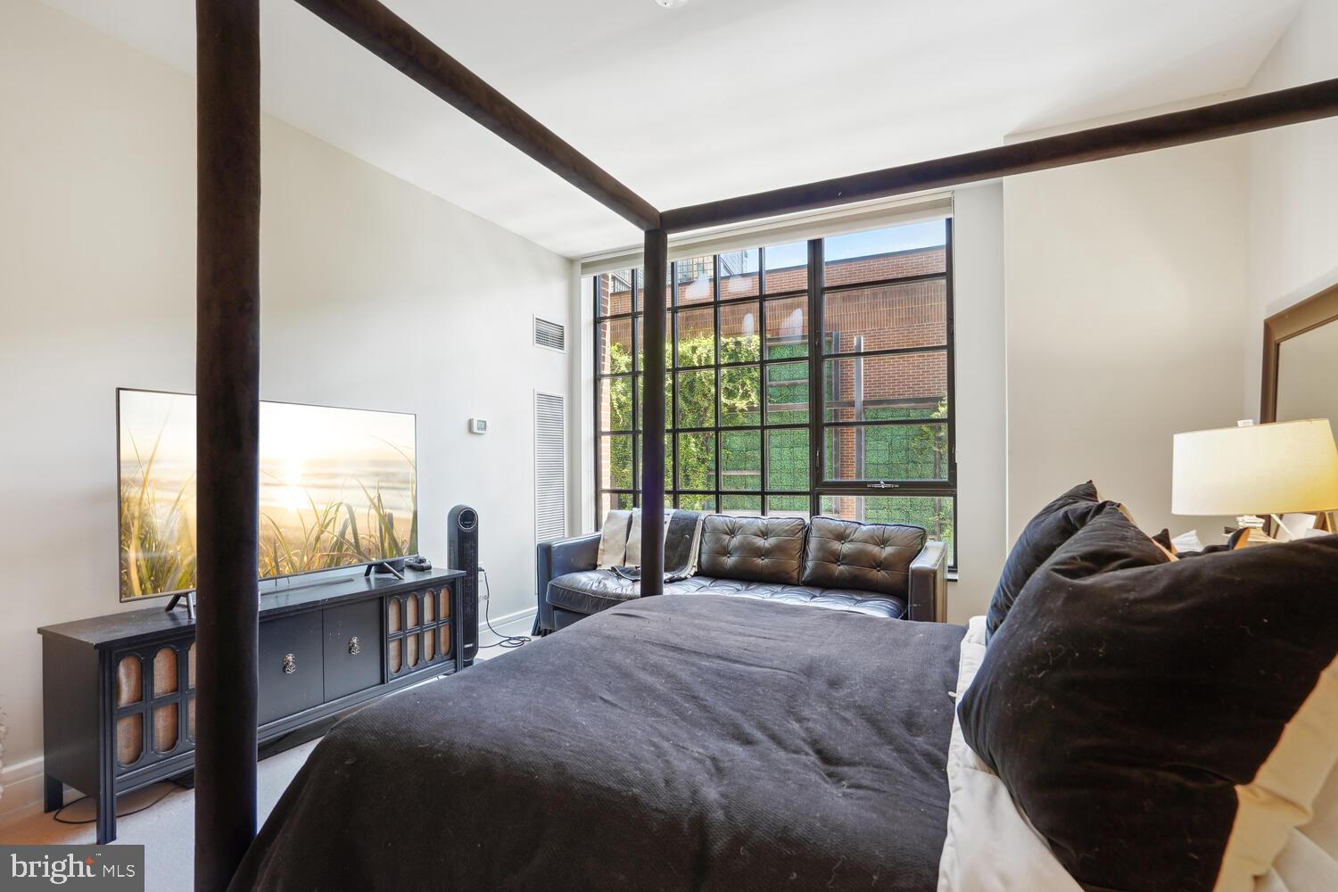 3303 Water Street Northwest, Unit 3L Washington, DC 20007 - Photo 24 of 40 Serene king-size primary bedroom suite