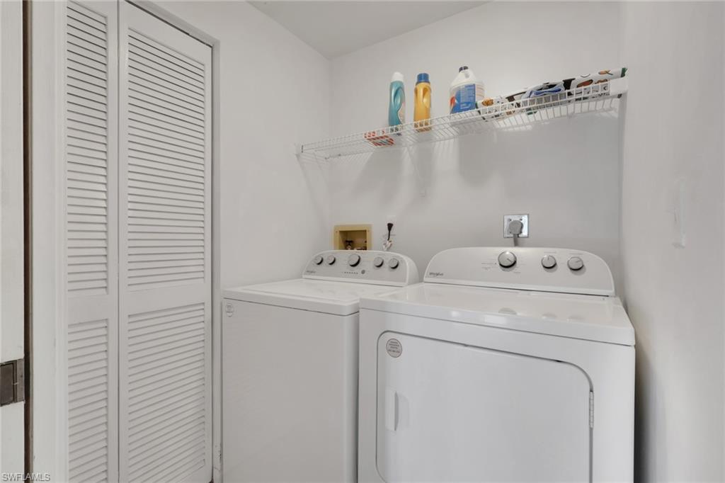 6260 Bellerive Avenue, Unit 4 Naples, FL 34119 - Photo 21 of 27 a utility room with dryer and washer