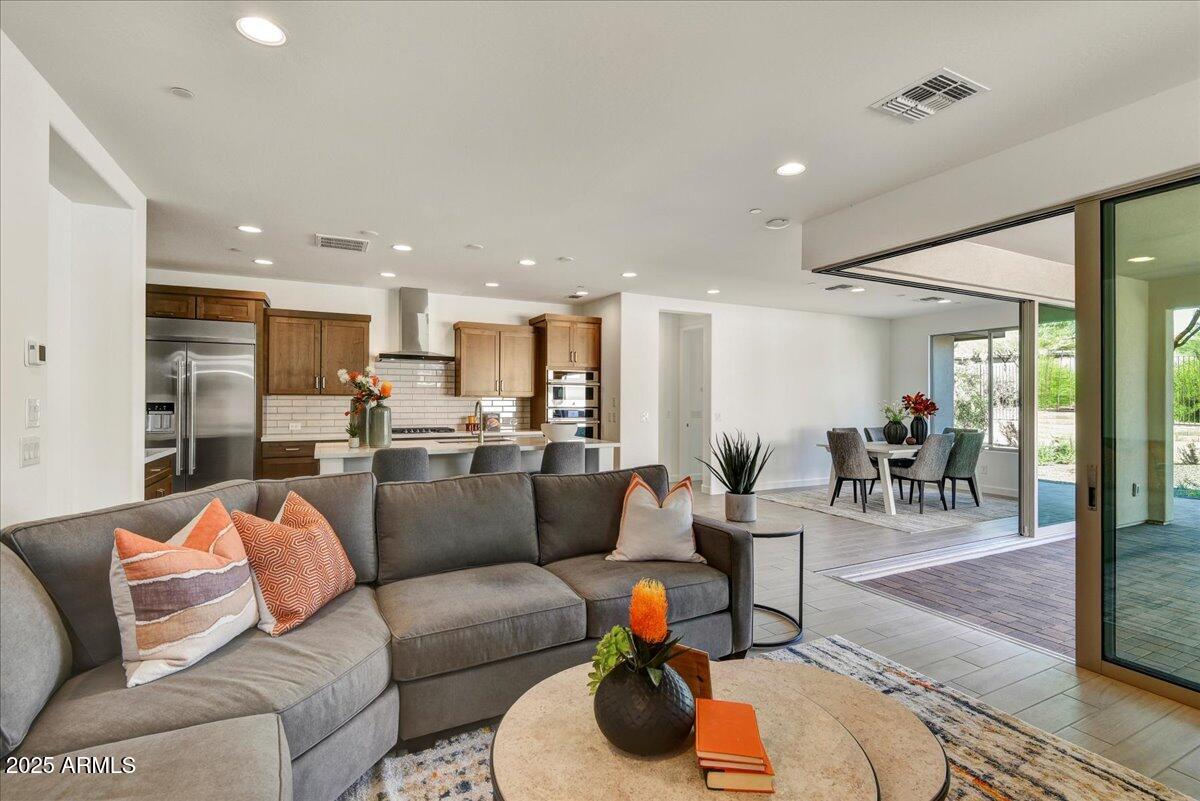 29008 North Juventino Way Rio Verde, AZ 85263 - Photo 11 of 50 a living room with furniture and a view of kitchen