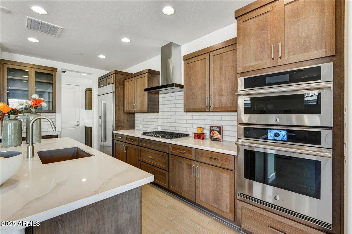 29008 North Juventino Way Rio Verde, AZ 85263 - Photo 15 of 50 a kitchen with stainless steel appliances granite countertop a sink stove and microwave