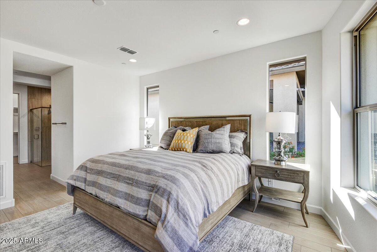 29008 North Juventino Way Rio Verde, AZ 85263 - Photo 22 of 50 a bedroom with bed and a night stand