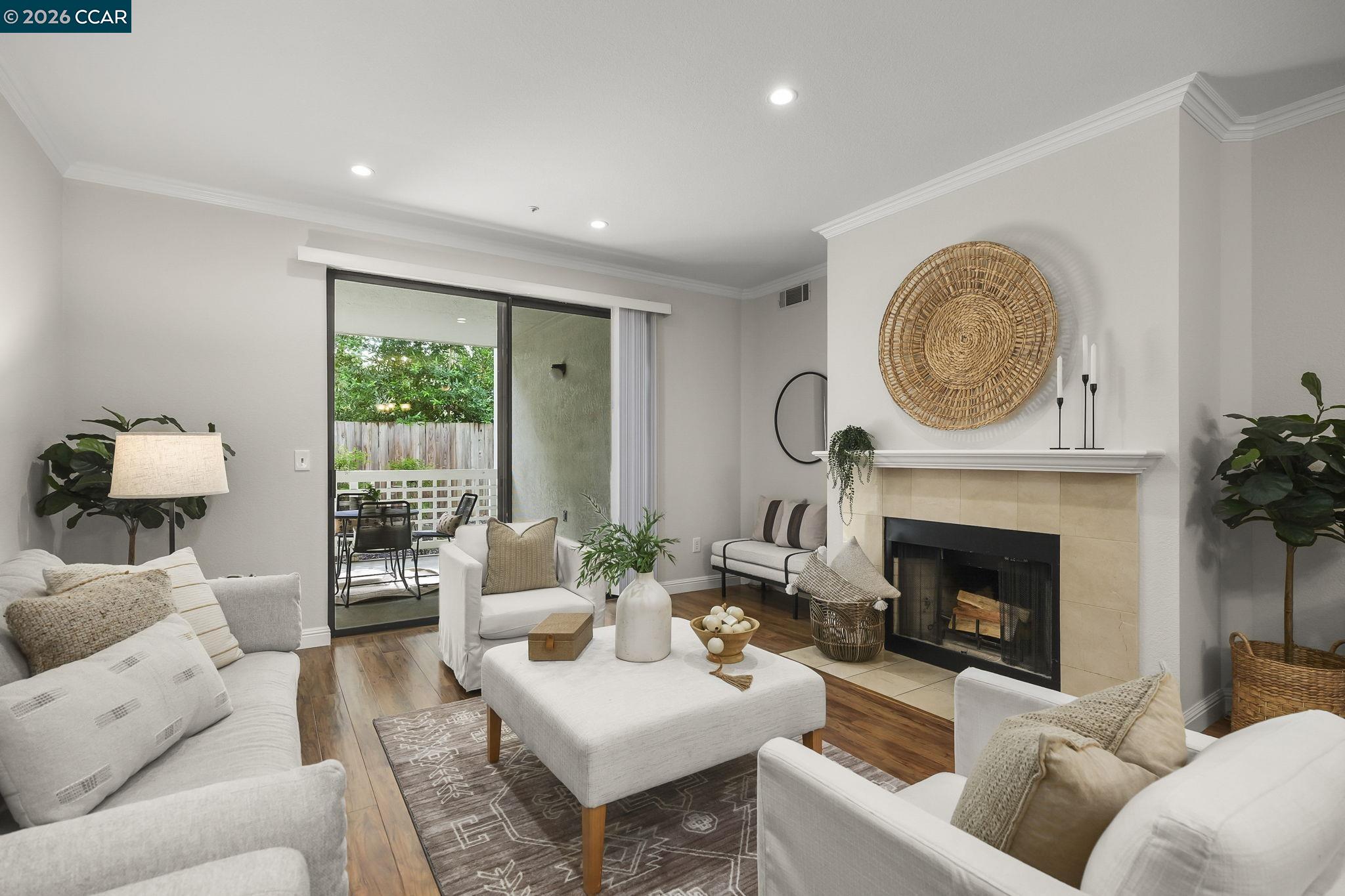 2586 Oak Road, Unit 130 Walnut Creek, CA 94597 - Photo 1 of 31 a living room with furniture and a fireplace