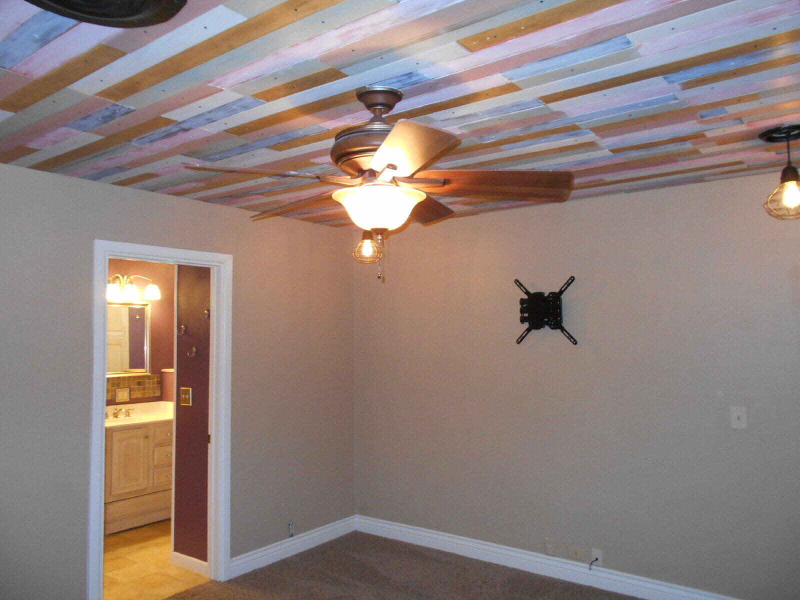 4431 77th Street Lubbock, TX 79424 - Photo 8 of 19 a view of a room with an empty space and a ceiling fan