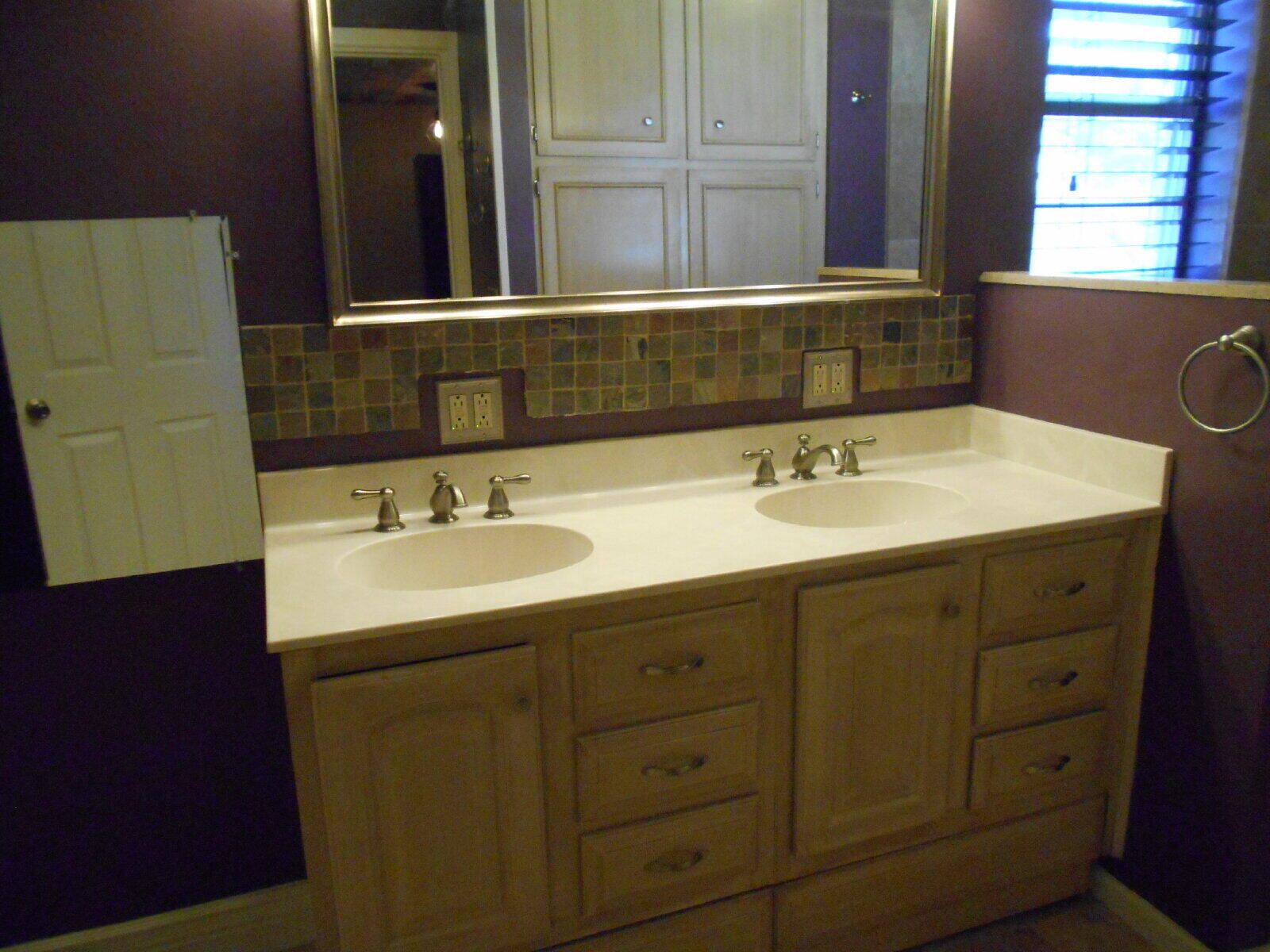 4431 77th Street Lubbock, TX 79424 - Photo 9 of 19 a bathroom with a sink and a mirror
