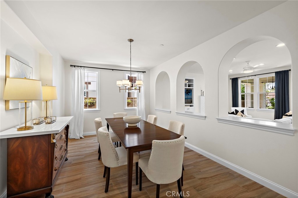 3 Tranquility Place Ladera Ranch, CA 92694 - Photo 12 of 63 a view of a dining room with furniture and wooden floor