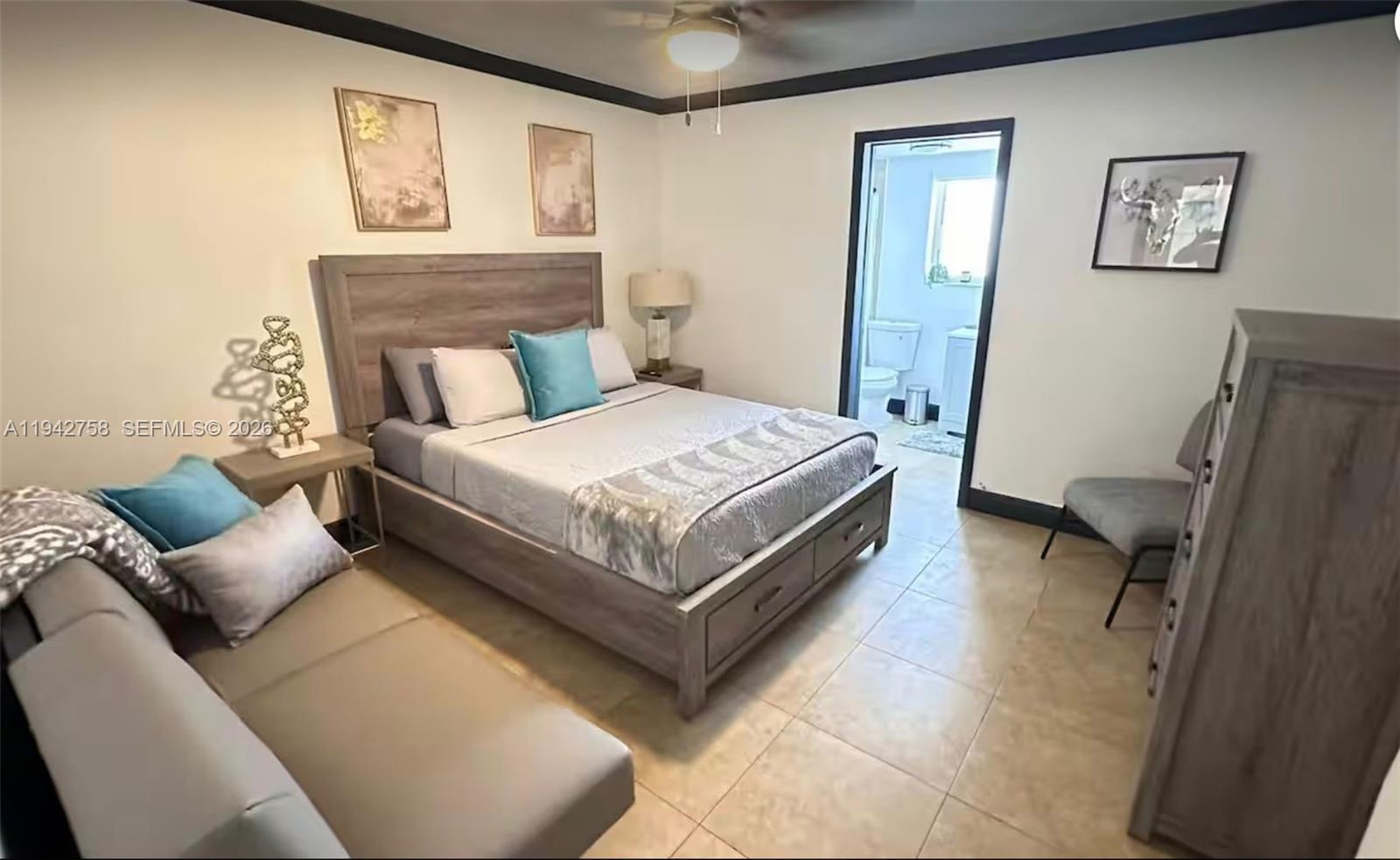 747 East 19th Street Hialeah, FL 33013 - Photo 19 of 37 a bed room with a bed and a couch
