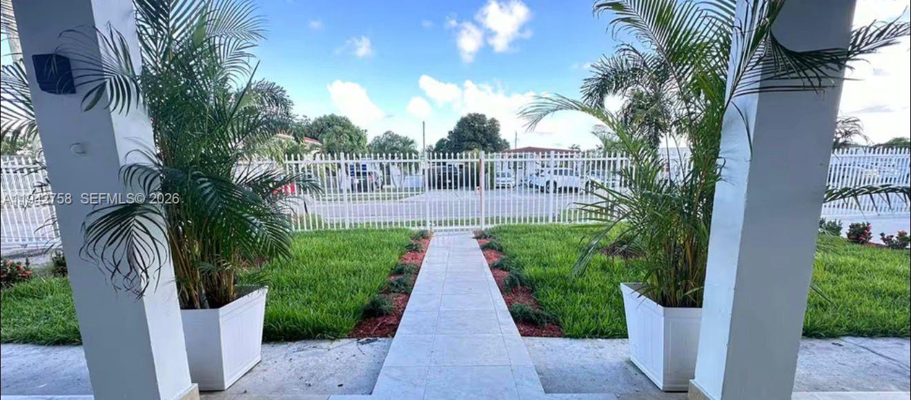 747 East 19th Street Hialeah, FL 33013 - Photo 2 of 37 a view of a pathway with a garden