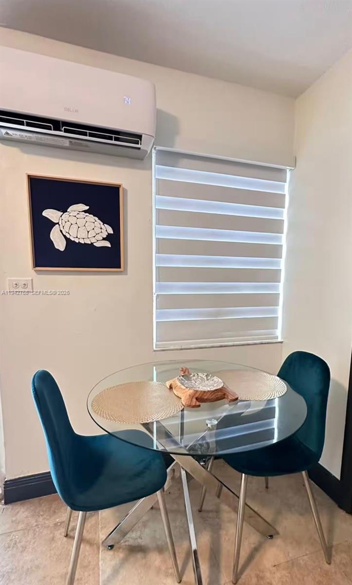 747 East 19th Street Hialeah, FL 33013 - Photo 23 of 37 a view of a dining room with furniture and wooden floor
