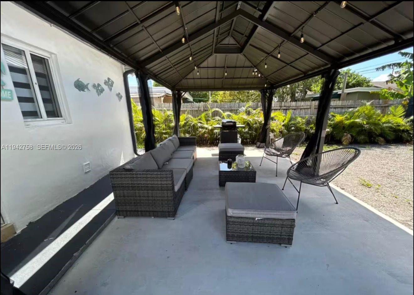 747 East 19th Street Hialeah, FL 33013 - Photo 29 of 37 a building outdoor space with patio furniture