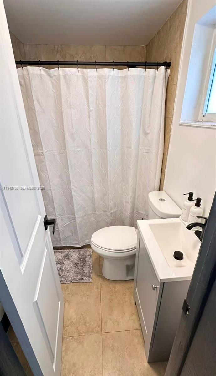 747 East 19th Street Hialeah, FL 33013 - Photo 32 of 37 a bathroom with a sink a toilet and a tub