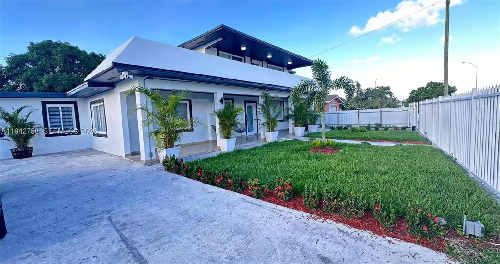747 East 19th Street Hialeah, FL 33013 - Photo 4 of 37 a view of a house with backyard and porch
