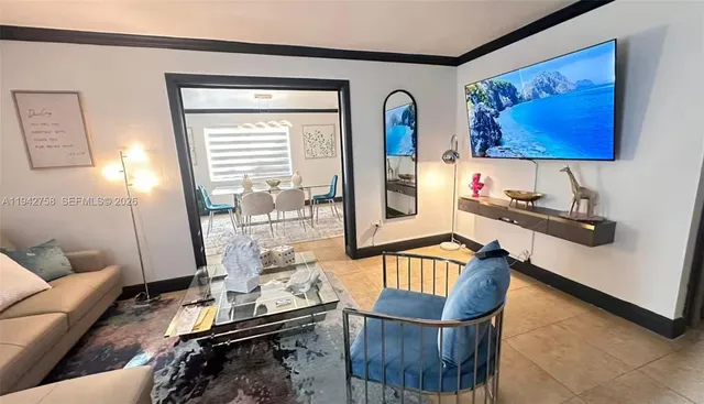 a living room with furniture and a flat screen tv