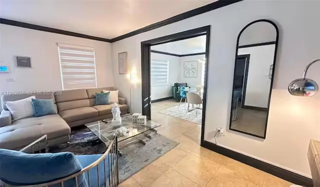 a living room with furniture and a window