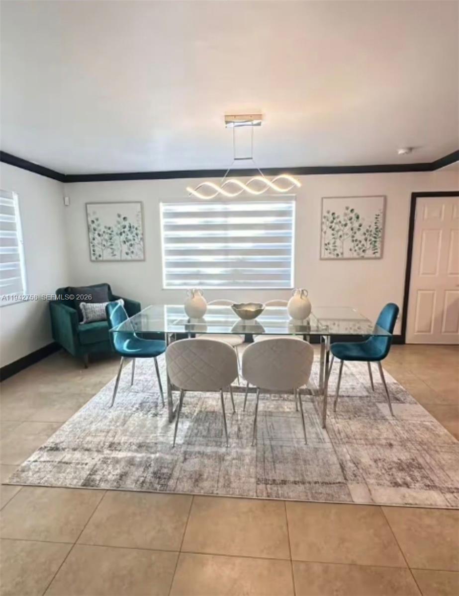 747 East 19th Street Hialeah, FL 33013 - Photo 9 of 37 a view of a livingroom with furniture and a couch