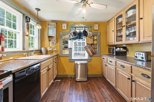 a kitchen with stainless steel appliances granite countertop a stove and a sink