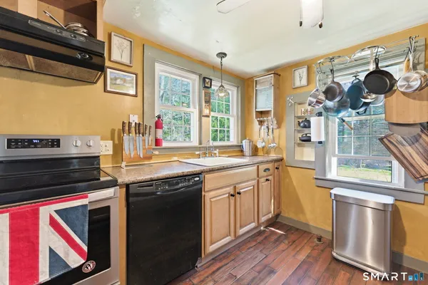a kitchen with a sink and a window