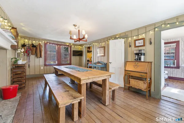 a bedroom with furniture and a rug