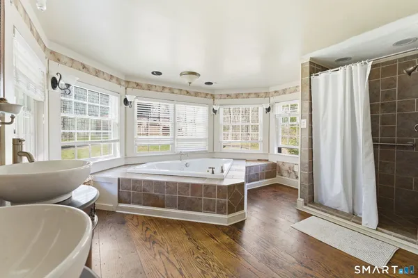 a bed room with a bed and a fireplace