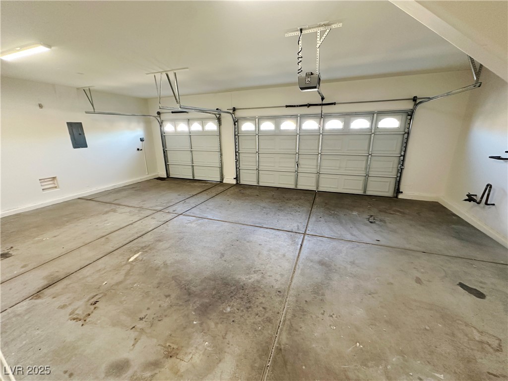 181 Ruby Ridge Avenue Henderson, NV 89002 - Photo 42 of 44 Garage featuring electric panel and a garage door opener