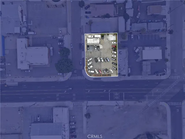 a living room with furniture kitchen view and a flat screen tv