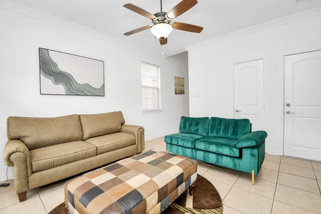 a living room with furniture and a rug