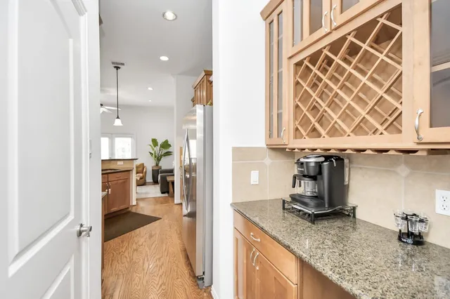 a view of a kitchen with a sink and cabinets
