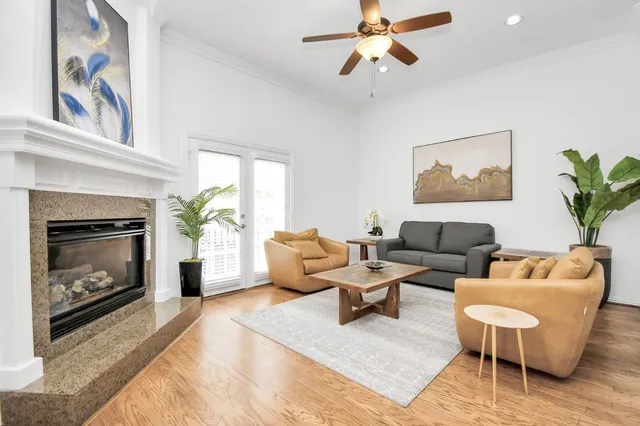 a living room with furniture and a fireplace