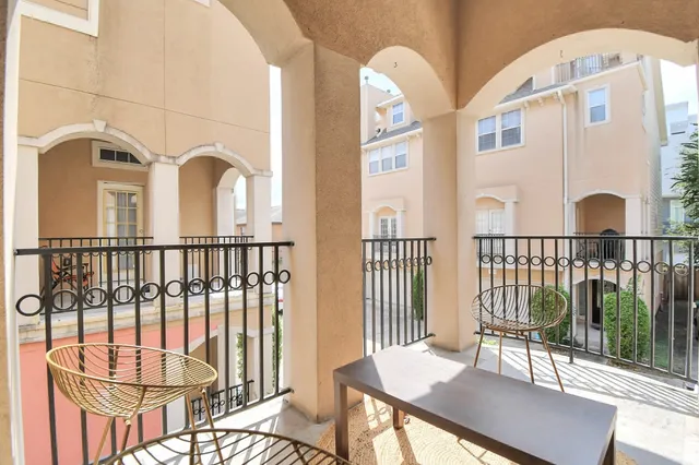 a view of a balcony and wooden floor