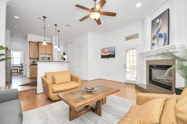 a living room with furniture and a fireplace