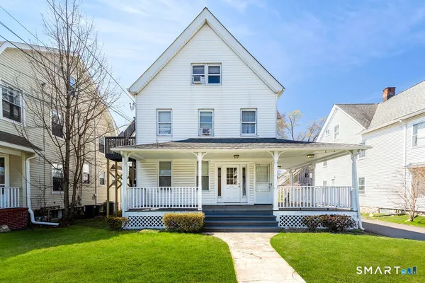 a front view of a house with a yard