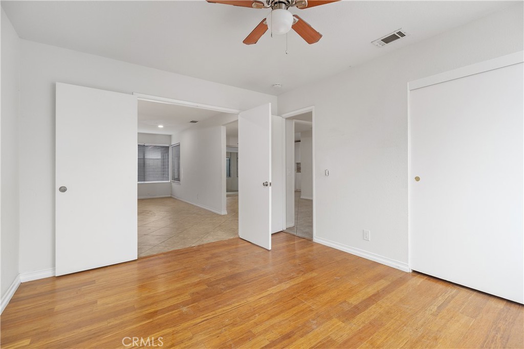 6897 Crest Avenue Riverside, CA 92503 - Photo 20 of 26 a view of empty room with wooden floor and ceiling fan