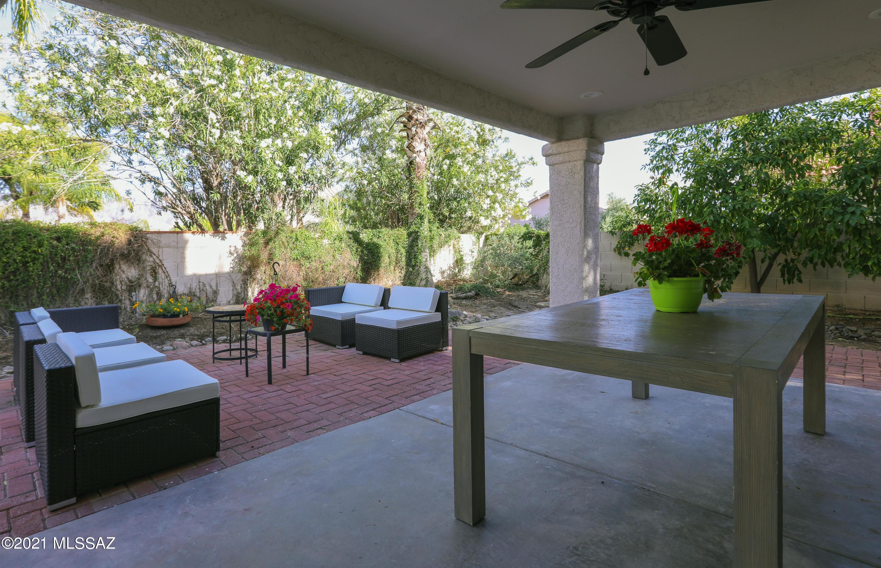 12560 North Wayfarer Way Oro Valley, AZ 85755 - Photo 17 of 43 a view of a patio with couches table and chairs and potted plants
