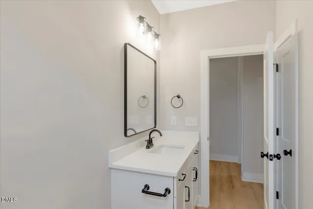 a bathroom with a sink and mirror