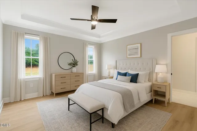 a bedroom with a bed a dresser and chair