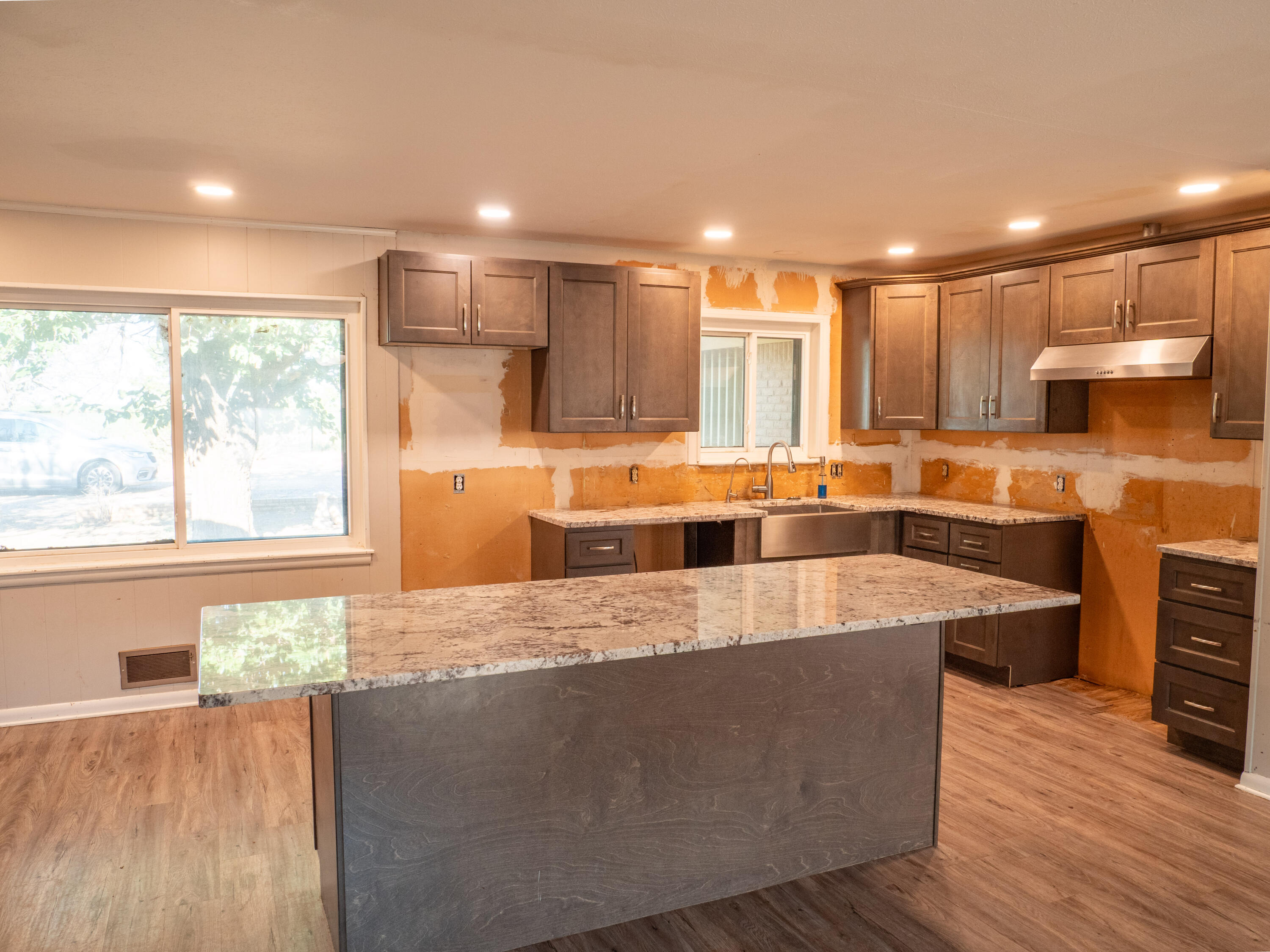 1131 County Road 125 Post, TX 79356 - Photo 12 of 27 a large kitchen with kitchen island a large island in it