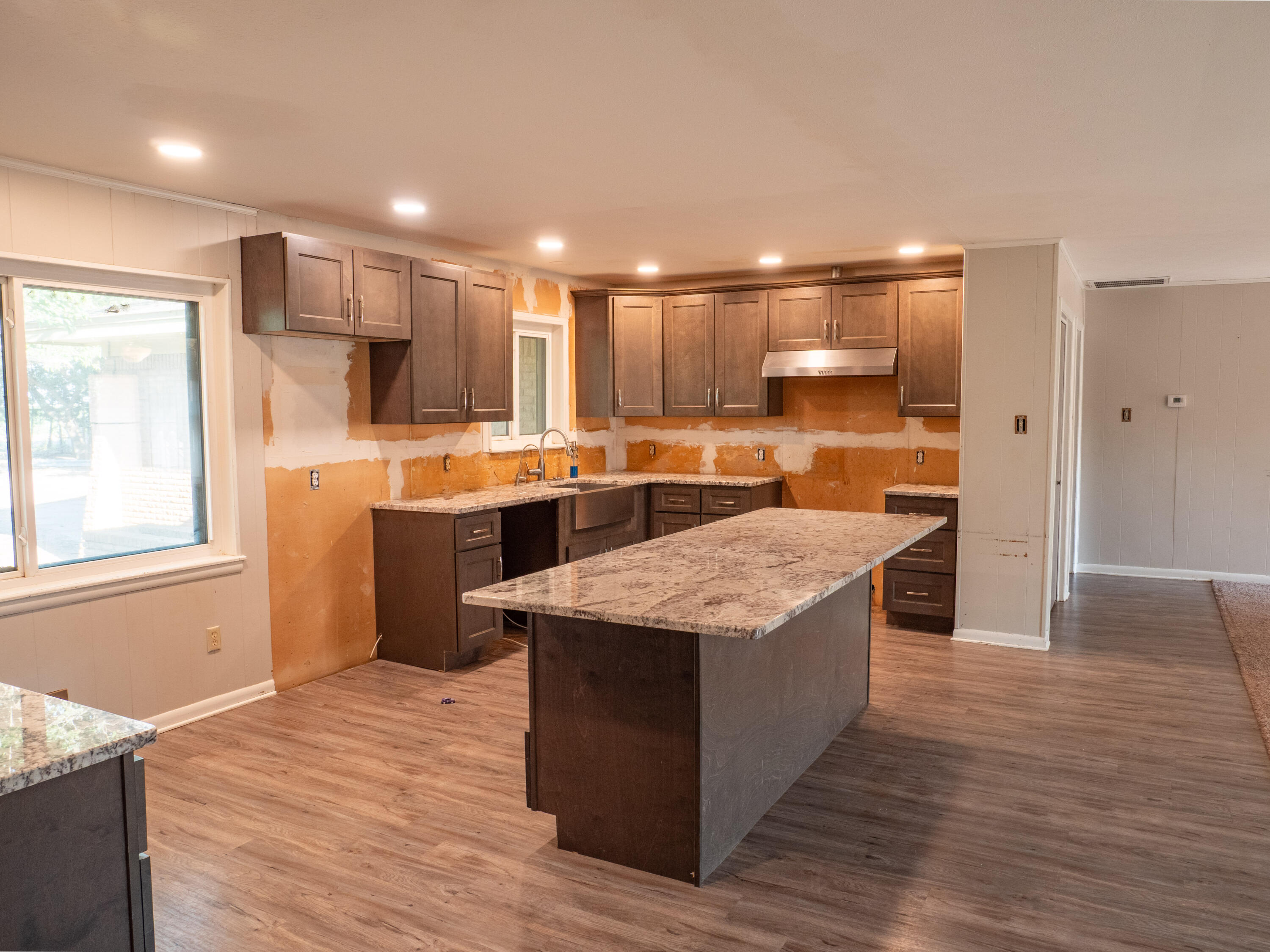 1131 County Road 125 Post, TX 79356 - Photo 13 of 27 a kitchen with stainless steel appliances granite countertop a table and chairs