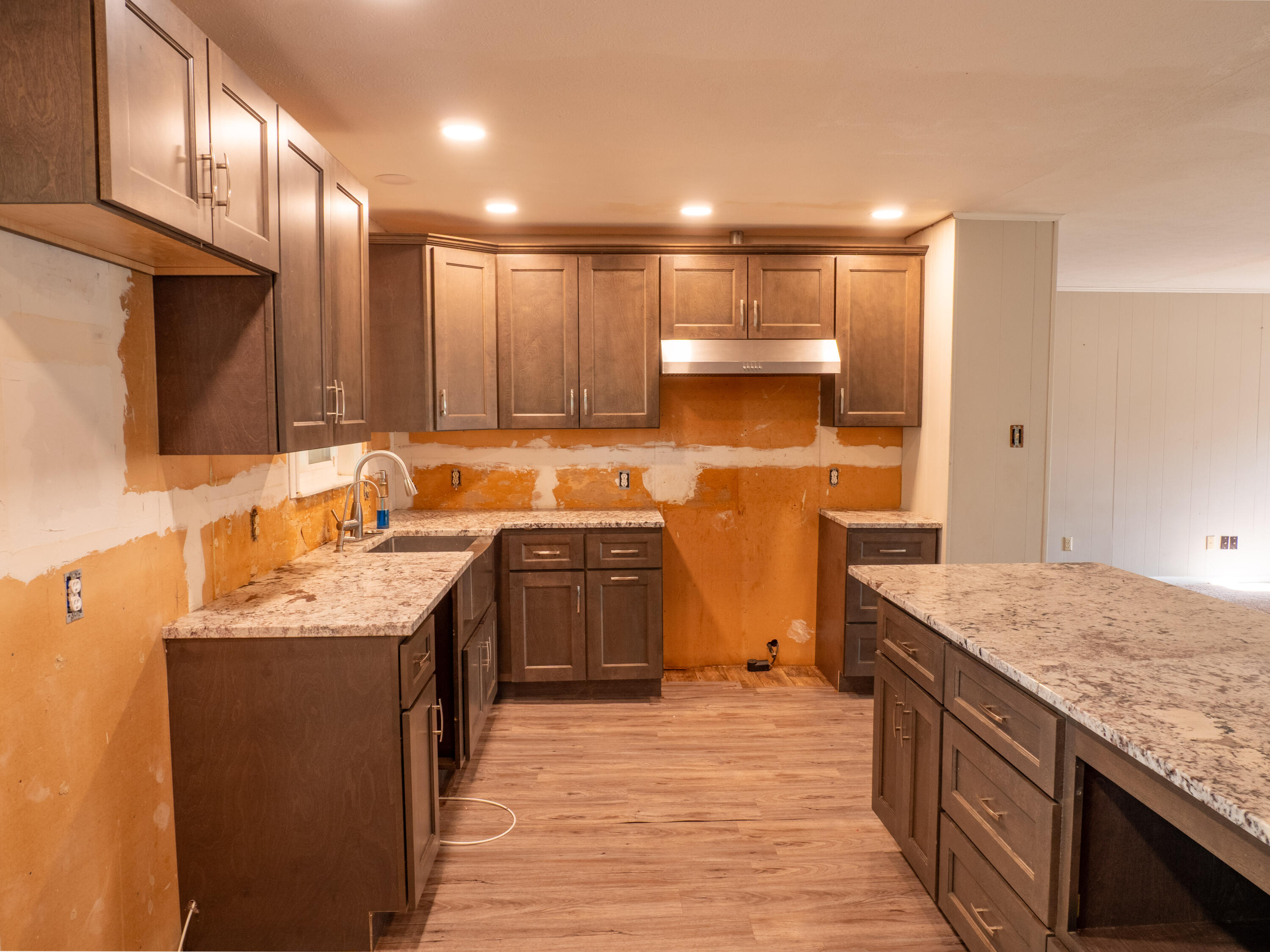 1131 County Road 125 Post, TX 79356 - Photo 14 of 27 a kitchen with stainless steel appliances granite countertop a sink stove and refrigerator