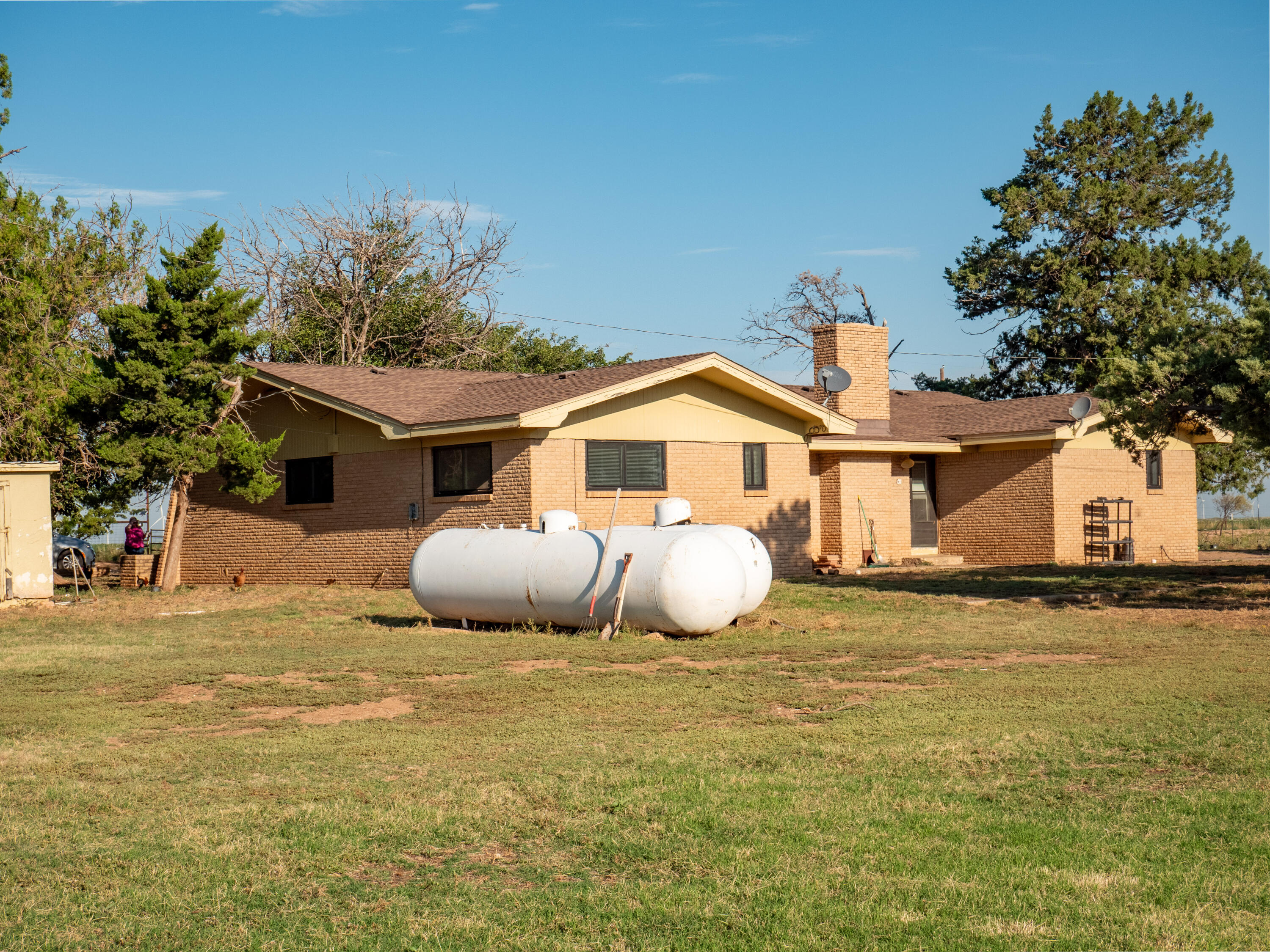 1131 County Road 125 Post, TX 79356 - Photo 2 of 27 a front view of a house with a yard