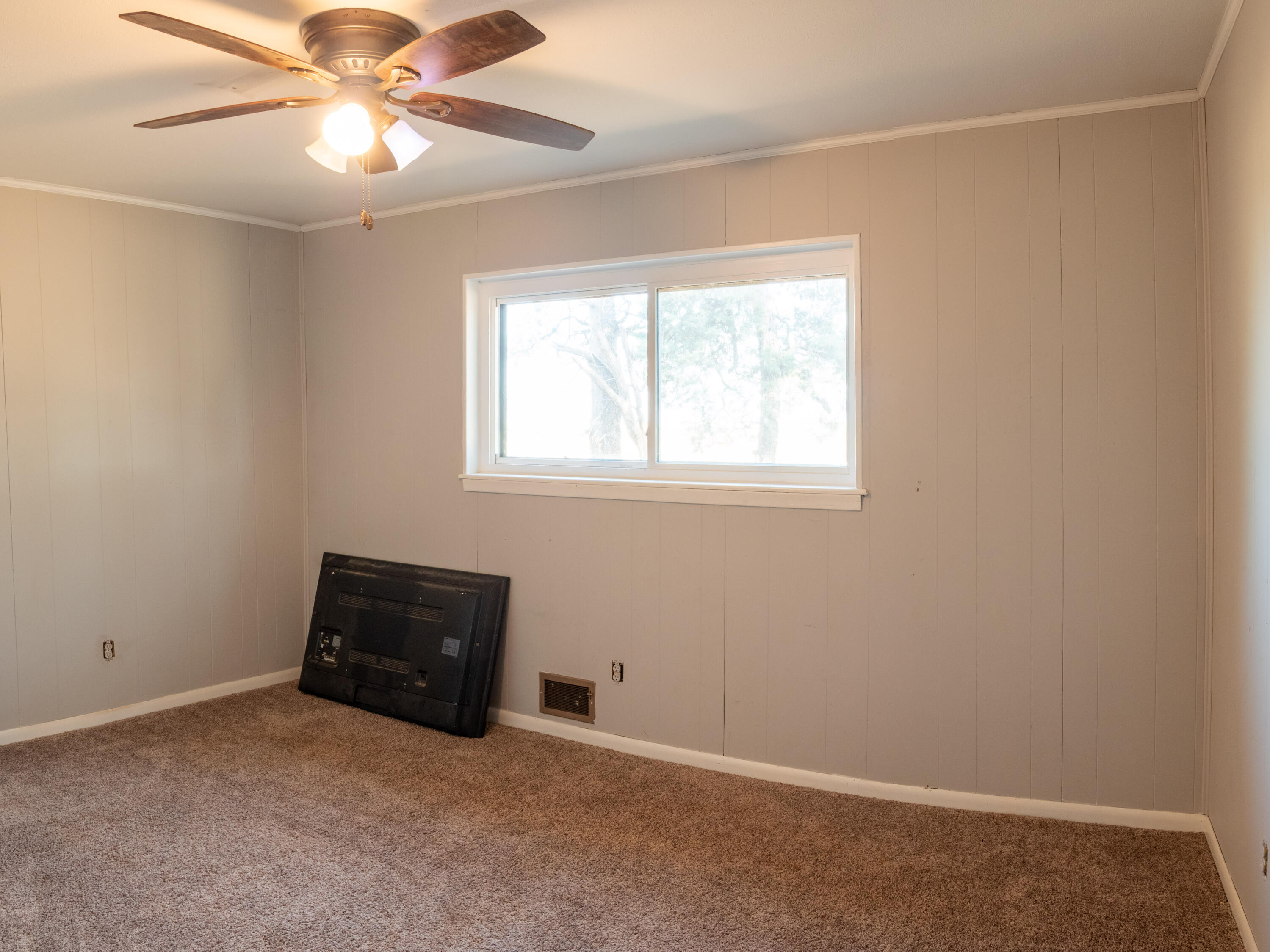 1131 County Road 125 Post, TX 79356 - Photo 27 of 27 an empty room with windows and fan
