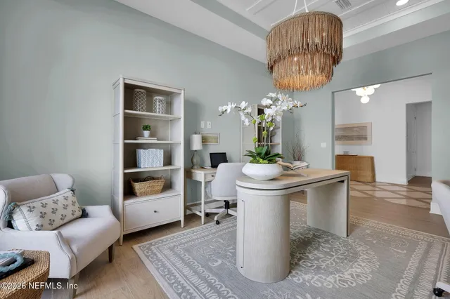 a large kitchen with a table and chairs
