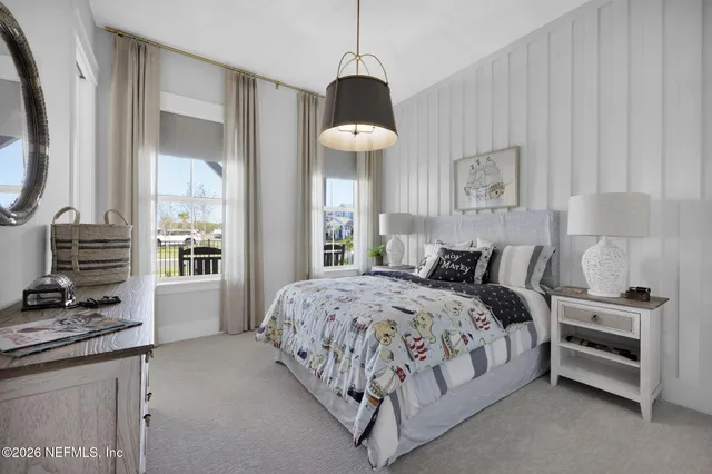 a view of living room with furniture and a flat screen tv