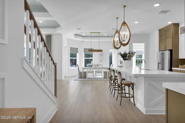 a kitchen with cabinets and window