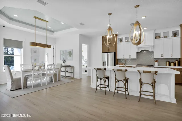 a view of a kitchen with sink washer and dryer