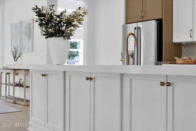 a bathroom with a toilet a sink and a mirror