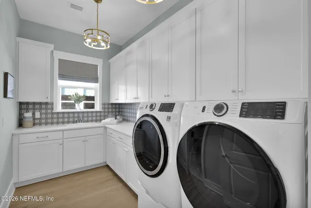 a potted plant sitting on a floor in a bathroom