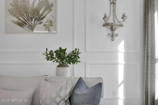 a living room with fireplace furniture and a wooden floor
